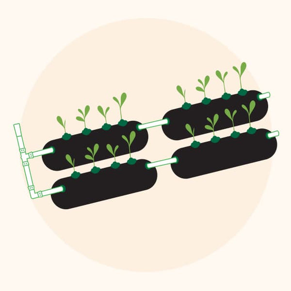 This easy-to-install drip irrigation system attaches to your garden hose to make watering effortless.